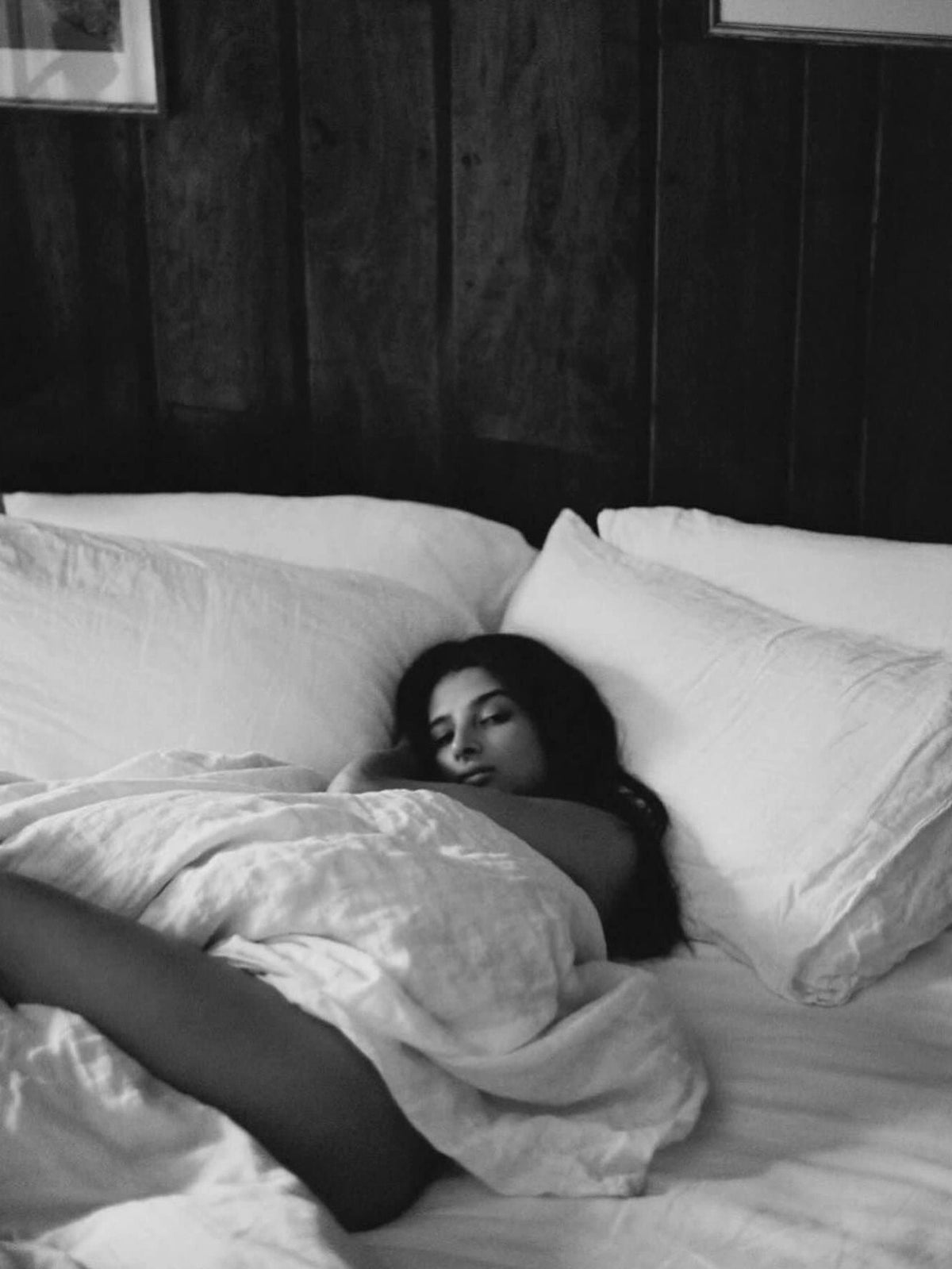 Split image of sunrise and moonlit night sky representing the science of chronotypes morning larks and night owls and whether your natural sleep timing can be changed. sleeping woman
