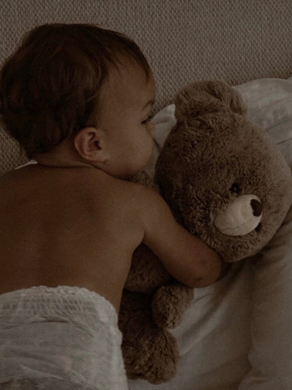 Child holding a comfort object demonstrating attachment, emotional regulation, and healthy child development.